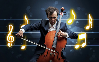 Young handsome cellist playing with music sheet background