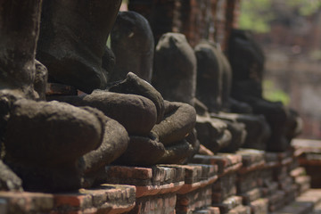 Fototapeta na wymiar Sandstone Buddha at Wat Mahathat, Ayutthaya, Thailand