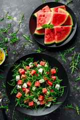 Fresh Juicy Watermelon arugula Feta salad with mint and orange, lemon dressing. summer dish. healthy food