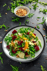 Fresh Beet, Orange salad with wild rocket, cheese and Pine nuts. healthy summer food