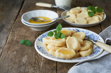 Cottage cheese vareniki with butter on a plate 