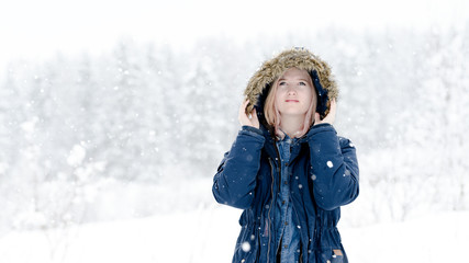 Fototapeta na wymiar Young woman in snow with coat, Norwegian winter