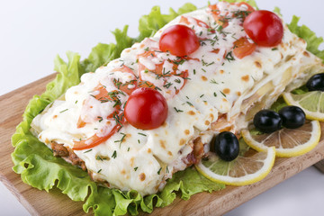 Italian lasagna close-up on the table.