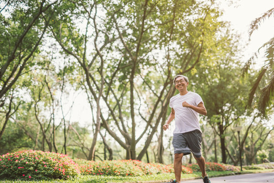 Asian Senior Mature Man Running Jogging In Park