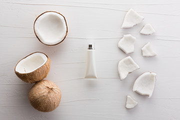 Homemade coconut products on white wooden table background from top view. Good for space and background.