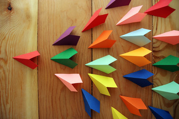 Origami paper sailboats, leadership business concept