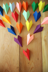 Origami paper sailboats, leadership business concept