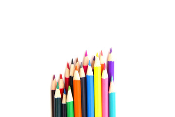 Multicolored pensils on the white paper.