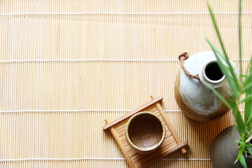 sake japanese oriental drink style on Bamboo table Top view