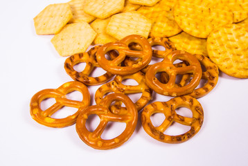 Mix of snacks : pretzels, crackers, cookies.
