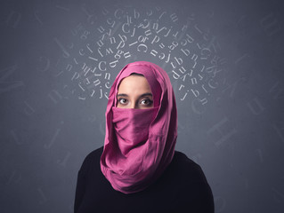 Young muslim woman wearing niqab with white alphabet letters above her head