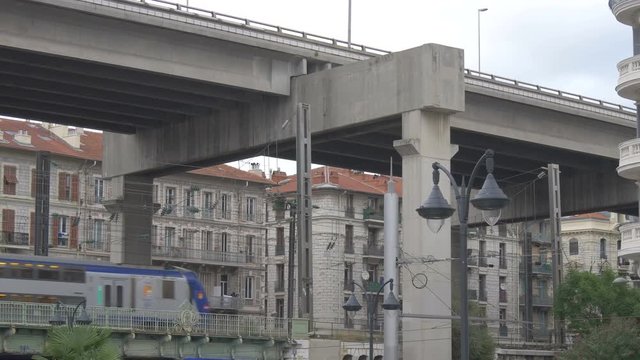 A double deck bridge near buildings
