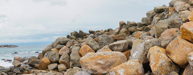 A ridge of rocks in the ocean.