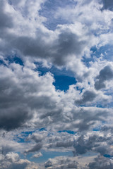 View of beautiful dramatic compositions of cumulus and stratus clouds on a bright blue sky