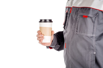 builder with cup of coffee over white wall background. repair, construction, building, people and...
