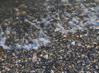 Pebble beach with sea water close up