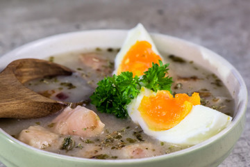Zurek - polish Easter soup with eggs and white sausage - closeup
