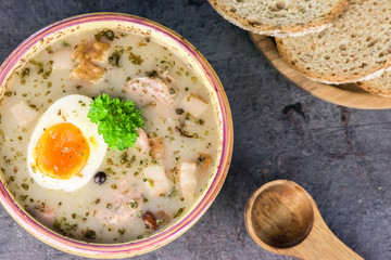 Zurek - polish Easter soup with eggs and white sausage - closeup