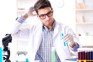 Chemistry student doing chemical experiments at classroom activi