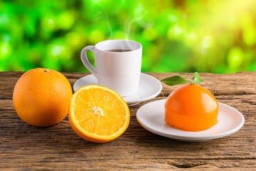 Orange cake on grunge wooden table
