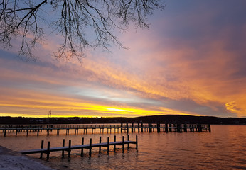 Fototapeta na wymiar Sunrise behind the pier at Lake Starnberg
