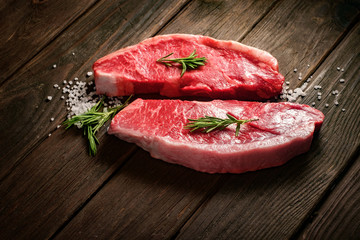 raw Picanha steak on wooden background in rustic style