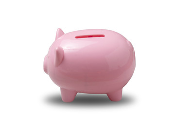 Piggy bank pink color filled with coins on concrete background.Saving investment concept.
