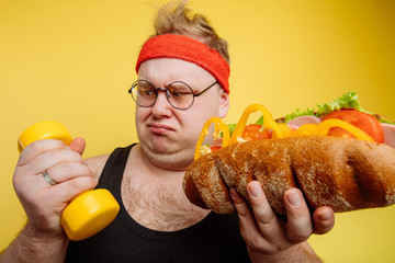 fat funny Man is carried away by temptation