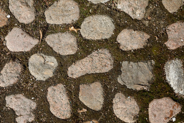 Granite cobble stone pavement background texture.