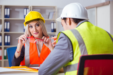 Construction workers having discussion in office before starting