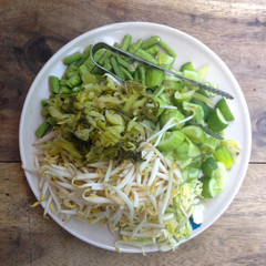 Variety of local vegetables having with curry rice noodle