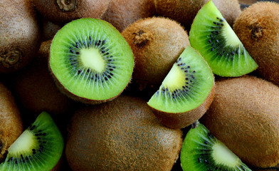 A lot of fresh Kiwi fruits  on wooden floor.
Kiwis are a nutrient dense food, they are high in nutrients and low in calories