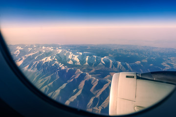 Amazing Snow Capped Mountains from the Airplane Window