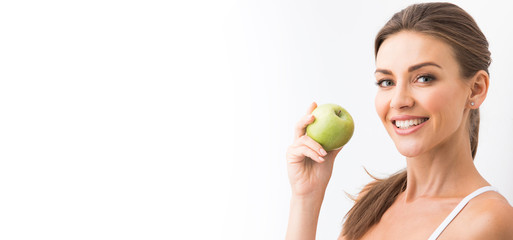 Woman with holding green apple