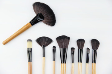 The cosmetic brush set put on background,for make up,professional brush set,the variation brushes for eyeshadow,lipstic,brush cheek,mascara,powder.beauty concept
