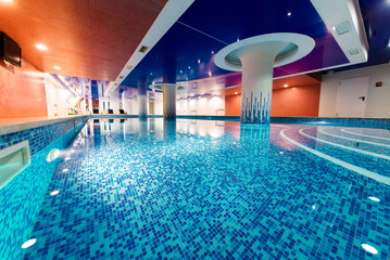 Exclusive swimming pool for swimming and recreation. With beautiful backlight and blue water.