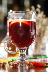 The traditional drink for winter evenings - mulled wine in the glass.