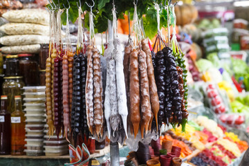 Traditional Georgian dessert Churchkhela, walnuts in grape juice