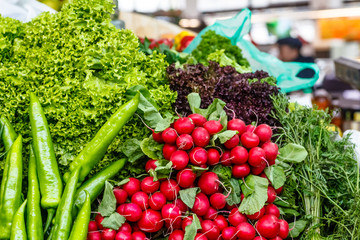 Cabbage, radish, carrots, onions and other vegetables on the market.