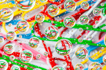 Color background with water drops and paper clips