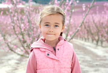 Little girl in a grove of fruit trees, Cieza. Spain