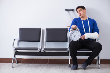 Desperate man waiting for his appointment in hospital with broke