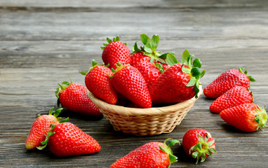 Colorful of fresh Strawberry in the basket on wooden background