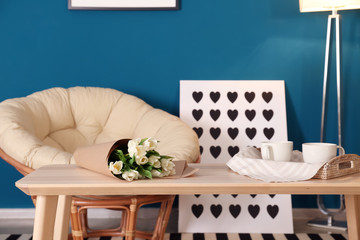 Elegant living room interior with table and papasan