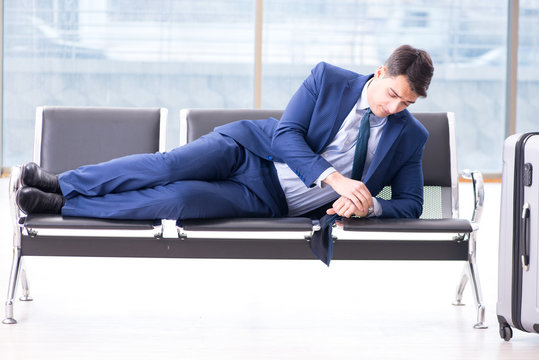 Businessman waiting at the airport for his plane in business cla