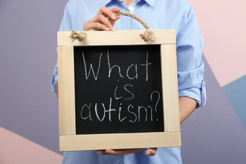 Woman holding blackboard with phrase 