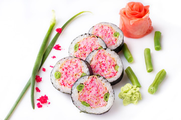 Sushi roll turned on a white background. Sushi Japanese food in a restaurant. Japanese restaurant menu. Unusual pink rolls. Isolated.