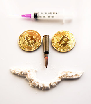 Bitcoins, a syringe, a bullet and a cocaine as a symbol of crimes that can hide crypto-currency (a stylized portrait of a criminal and a terroris &ndash; concept)