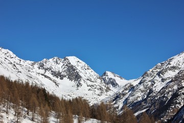 Fototapeta na wymiar Valley of Valnontey, snowy landscape. Aosta Valley, Gran Paradiso National Park, Italy