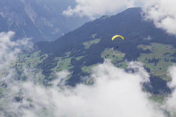 Alps panorama with kite flyer in Montafon, Austria.